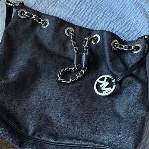 Michael Kors hand bags ,cross bag, and wristlet all in a bundle